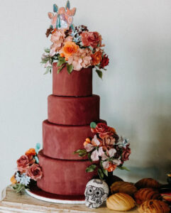 Rusty Pinkish Red Four Tier Wedding Cake with Sugar Flowers